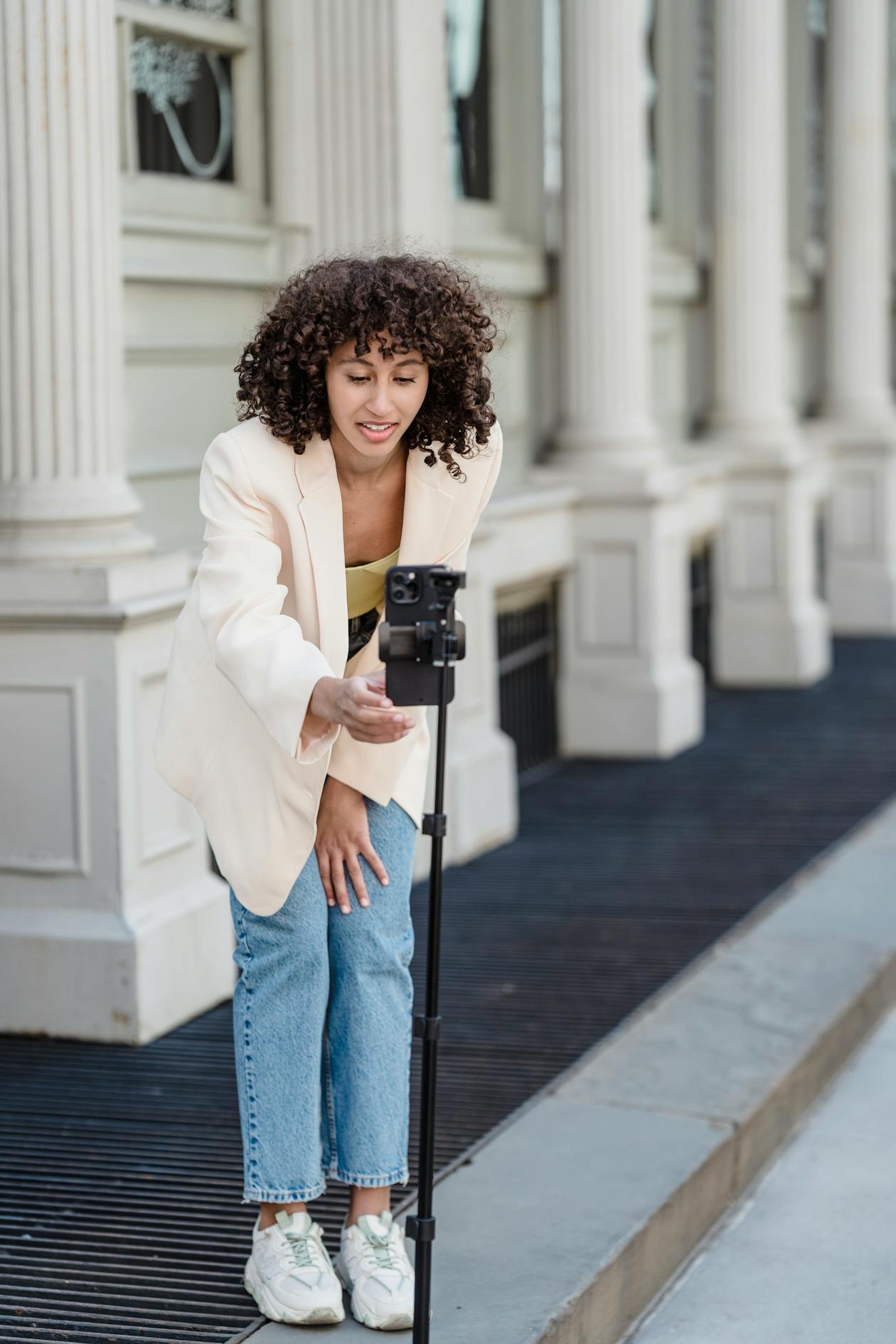 Creator speaking to phone on tripod outdoors
